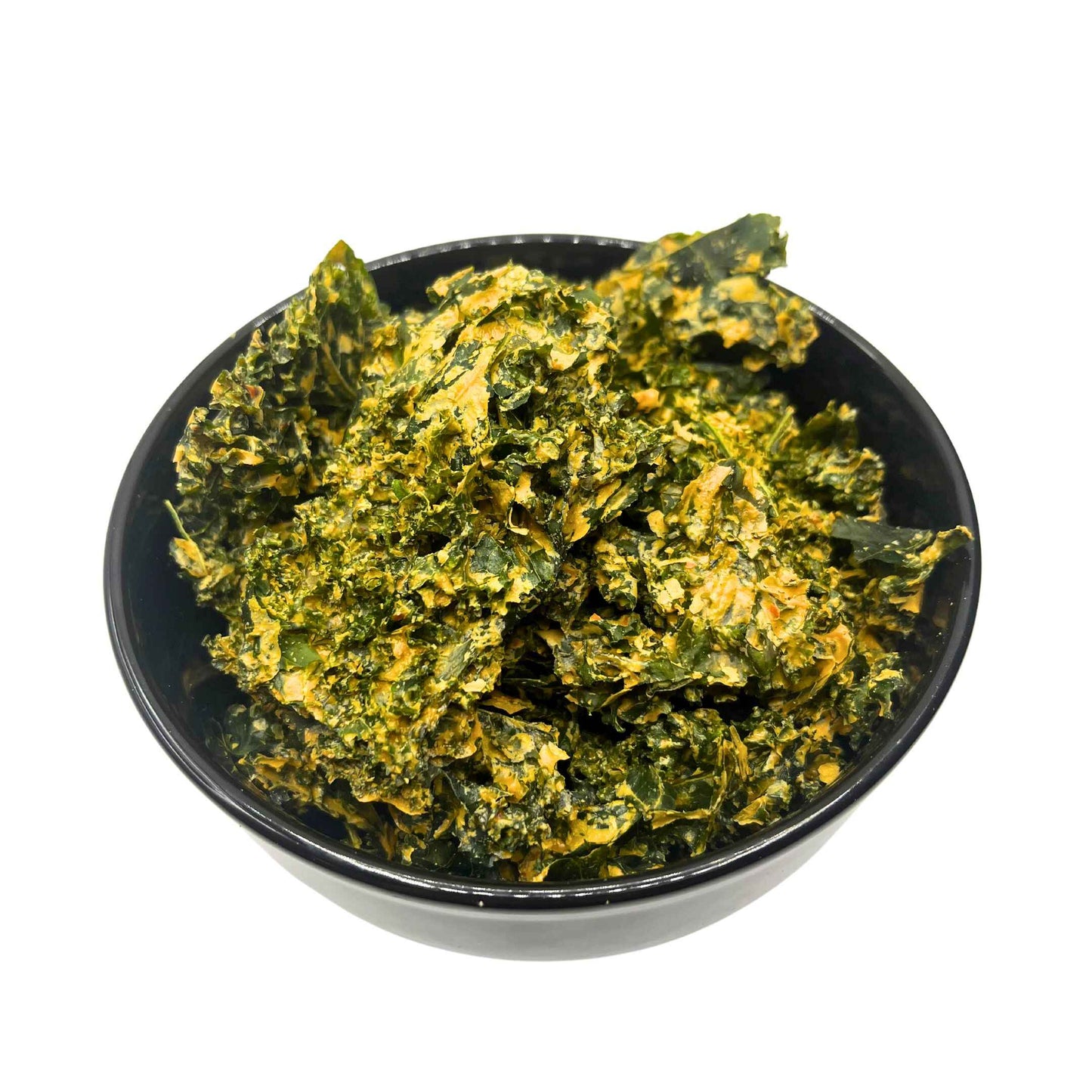 Delicious Vegan Kale Chips in a Bowl. You can see the different delicious seasonings on the kale pieces.