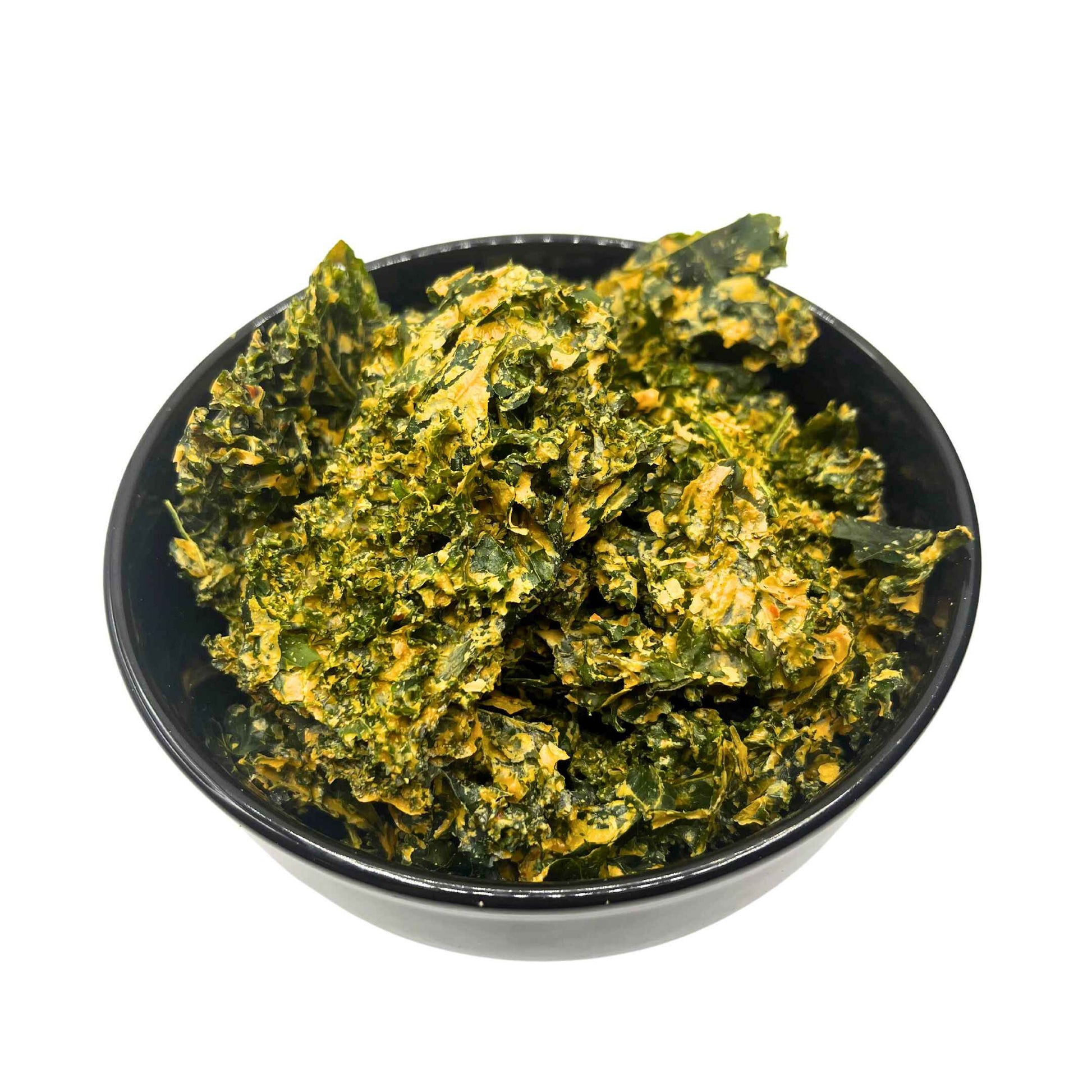 Delicious Vegan Kale Chips in a Bowl.  You can see the different delicious seasonings on the kale pieces.